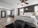 Spacious main bedroom with a seating area, laminate floors, and a large comfy bed at 1810 Kerwick Ct, Lancaster, SC 29720