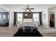 A bright and airy main bedroom featuring a large bed, an ottoman, and two side tables at 1810 Kerwick Ct, Lancaster, SC 29720