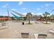 An outdoor pool area features lounge chairs, shade structures and an adjacent clubhouse at 1810 Kerwick Ct, Lancaster, SC 29720