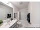 Stylish bathroom with modern fixtures, patterned floor, and neutral color scheme at 205 Cliffwood Nw St # A-1, Concord, NC 28027