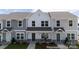 Charming townhomes feature modern farmhouse design with stone accents and inviting entryways at 205 Cliffwood Nw St # A-1, Concord, NC 28027