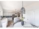 Modern kitchen boasts stainless appliances, a breakfast bar, and stylish lighting fixtures at 205 Cliffwood Nw St # A-1, Concord, NC 28027