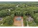 New construction aerial view of home nestled in a mature treed lot with a private driveway and landscaping at 209 Stafford Estates Dr, Salisbury, NC 28146