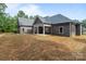 Expansive backyard featuring a charming covered patio, perfect for enjoying the outdoors and entertaining guests at 209 Stafford Estates Dr, Salisbury, NC 28146