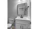 A stylish bathroom featuring a modern vanity and a large mirror at 209 Stafford Estates Dr, Salisbury, NC 28146