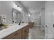Expansive bathroom with double vanity and sinks, providing ample space and modern design for a luxurious feel at 209 Stafford Estates Dr, Salisbury, NC 28146