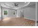 Spacious main bedroom showcasing natural light from two windows and a ceiling fan for added comfort at 209 Stafford Estates Dr, Salisbury, NC 28146