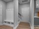 A bright entryway with a built-in bench and coat rack at 209 Stafford Estates Dr, Salisbury, NC 28146