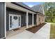 Inviting front entrance with a decorated white door and modern exterior lighting at 209 Stafford Estates Dr, Salisbury, NC 28146