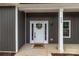 Inviting front entrance with a decorated white door and modern exterior lighting at 209 Stafford Estates Dr, Salisbury, NC 28146