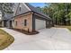 Spacious two-car garage with a concrete driveway and manicured landscaping at 209 Stafford Estates Dr, Salisbury, NC 28146