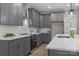 Updated kitchen features gray cabinets, white countertops, and stainless steel appliances at 209 Stafford Estates Dr, Salisbury, NC 28146