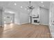 Bright living room boasts a vaulted ceiling, modern ceiling fan, and cozy fireplace at 209 Stafford Estates Dr, Salisbury, NC 28146