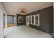 Covered patio featuring a ceiling fan and neutral flooring, offering a versatile outdoor living space at 209 Stafford Estates Dr, Salisbury, NC 28146