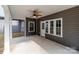 Cozy covered patio with ceiling fan, offering an ideal outdoor retreat with ample sunlight and an access door at 209 Stafford Estates Dr, Salisbury, NC 28146