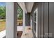 Welcoming front porch with white columns and a view of the landscaped yard at 209 Stafford Estates Dr, Salisbury, NC 28146