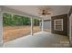 Covered porch with decorative ceiling fan and concrete floor at 209 Stafford Estates Dr, Salisbury, NC 28146