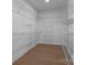 Organized walk-in closet with metal shelving offering ample storage, creating a functional and efficient space at 209 Stafford Estates Dr, Salisbury, NC 28146