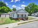 Classic exterior of a single Gathering home showcasing well-maintained landscaping and a detached two car garage at 220 Parker Ave, Mooresville, NC 28115