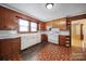 Well-equipped kitchen with ample storage, classic appliances, and an efficient layout for easy cooking at 220 Parker Ave, Mooresville, NC 28115