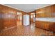 Functional kitchen layout offering ample cabinet storage, vintage appliances, and access to other living areas at 220 Parker Ave, Mooresville, NC 28115