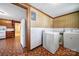Functional laundry room with washer, dryer, and access to kitchen at 220 Parker Ave, Mooresville, NC 28115