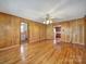 Classic living room featuring hardwood floors, and an open layout that connects to the kitchen at 220 Parker Ave, Mooresville, NC 28115