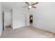 Spacious bedroom with double closets, ceiling fan, and an attached bathroom at 2223 Pacer Rd, Lancaster, SC 29720
