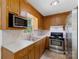 Well-lit kitchen with stainless steel appliances and neutral countertops at 2223 Pacer Rd, Lancaster, SC 29720