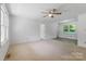Open living room area with natural light and neutral carpet at 2223 Pacer Rd, Lancaster, SC 29720