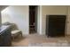 Bedroom featuring a dark dresser, chair, and closet, providing ample storage and style with natural light at 2411 Bonterra Blvd, Indian Trail, NC 28079