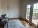 Versatile bonus room with hardwood floors, closet, and access to the outdoor deck at 2411 Bonterra Blvd, Indian Trail, NC 28079