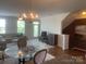 Open living room with chandelier, hardwood floors, and comfortable seating arrangement at 2411 Bonterra Blvd, Indian Trail, NC 28079