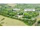 Aerial view of the home and detached garage surrounded by lush green trees at 2949 Anderson Burgess Rd, Sharon, SC at 2949 Anderson Burgess Rd, Sharon, SC 29742