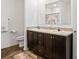 Bathroom with double vanity, wood cabinets, and a floral-themed shower curtain at 2949 Anderson Burgess Rd, Sharon, SC 29742