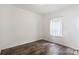 Empty bedroom with wood-look flooring and a window with sheer curtains at 2949 Anderson Burgess Rd, Sharon, SC 29742