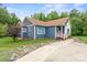 Cozy home with blue siding, white trim, and charming accents, offering curb appeal and a welcoming entrance at 2949 Anderson Burgess Rd, Sharon, SC 29742