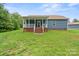 Exterior of a blue house featuring a covered back porch and lawn at 2949 Anderson Burgess Rd, Sharon, SC 29742