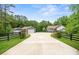 Charming home with long driveway, lush lawn, and stone accents near trees, offering curb appeal and privacy at 2949 Anderson Burgess Rd, Sharon, SC 29742
