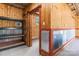 Inside this garage is wood paneling, metal accents, and shelving providing both durability and organizational options at 2949 Anderson Burgess Rd, Sharon, SC 29742