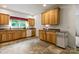 Kitchen features wood cabinets, a window over the sink, and tiled floors at 2949 Anderson Burgess Rd, Sharon, SC 29742