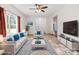 Staged living room featuring modern furniture, a large TV, and neutral decor for a comfortable and stylish ambiance at 2949 Anderson Burgess Rd, Sharon, SC 29742