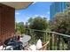 Outdoor balcony with views of the city and dining set at 300 W Fifth St # 509, Charlotte, NC 28202
