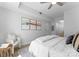 Relaxing bedroom with modern decor, natural light, and a cozy chair by the window with decorative wall art at 300 W Fifth St # 509, Charlotte, NC 28202