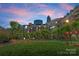 Condominium building exterior with lush greenery and landscaping, providing a serene and inviting atmosphere at 300 W Fifth St # 509, Charlotte, NC 28202