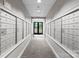 Hallway with mailboxes on either side and an exit sign above the door at the end of the hallway at 300 W Fifth St # 509, Charlotte, NC 28202