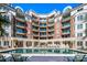 Beautiful outdoor pool with lounge chairs and manicured landscaping in a luxury apartment community at 300 W Fifth St # 509, Charlotte, NC 28202