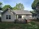 Home's rear exterior with deck and siding, showcasing a private backyard space at 3124 Burkston Rd, Charlotte, NC 28269