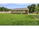 The backyard features a spacious lawn, chain link fence and rear view of the house at 3125 Leonard Dr, Gastonia, NC 28056