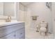 Bright bathroom featuring a vanity with sink, toilet, and shower with a shower curtain at 3125 Leonard Dr, Gastonia, NC 28056